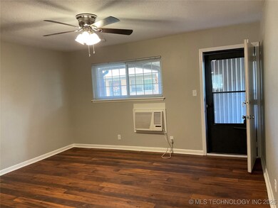 Foyer entrance featuring dark wood-type flooring,