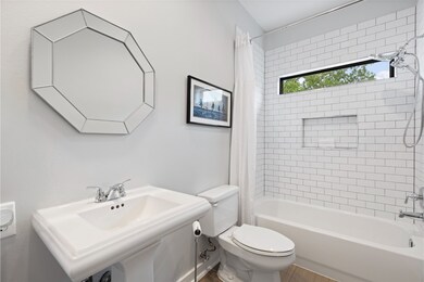 This renovated modern first floor bathroom feature