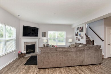 A comfortable family room that is open to the kitchen and breakfast area.  Great views overlooking nothing but trees.  Enjoy a cozy fire while curled up here watching TV!