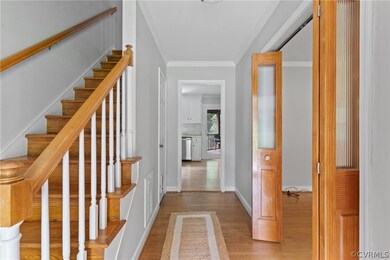 Staircase with ornamental molding and hardwood / w
