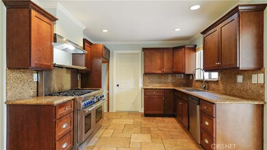 Gorgeous remodeled kitchen over looks back yard pool area