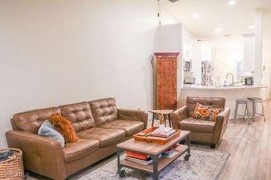Living area featuring light wood finished floors a