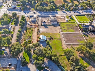 Aerial view of property's location featuring nearby suburban area