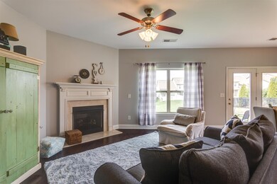 The family room includes a cozy fireplace and room to relax
