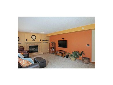 Family Room-L1. Fireplace has marble tile surround