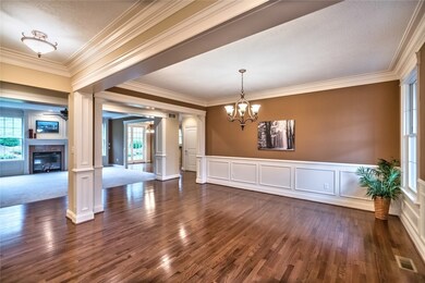 Elegant Hardwood Floor Dining Room with Fireplace