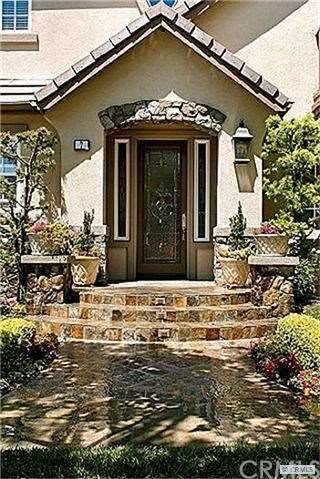Extensive Hardscape Adorn the Entry Walkway