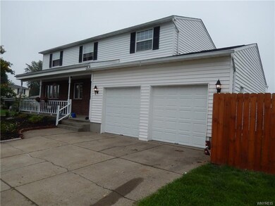OPEN PORCH W/FRESHLY PAINTED RAILINGS - TWO CAR GA