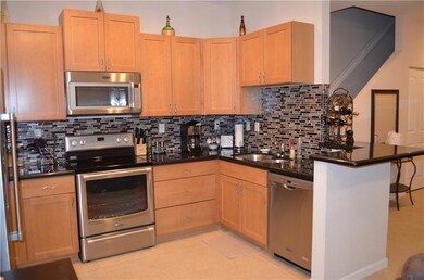 Kitchen with wood cabinets and granite counters