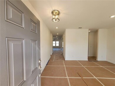 Spacious foyer with direct access to a dining room