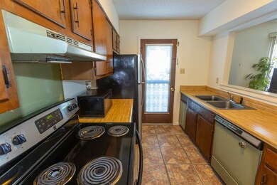 Kitchen with sink and black appliances
