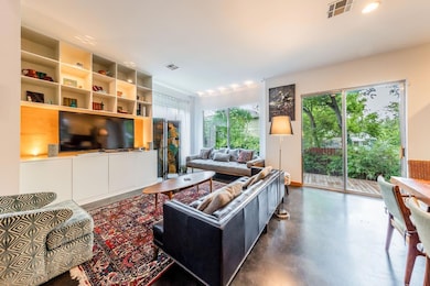 Living room featuring finished concrete flooring 