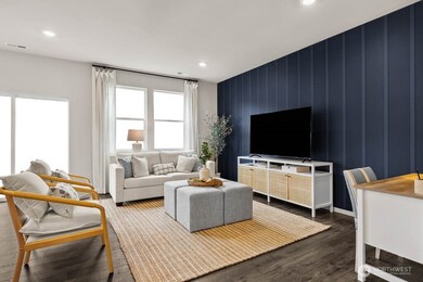 Large open great room with ample room for seating areas. Actual home is under construction. Colors, materials, and features may vary. See site agent for details.