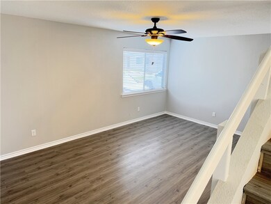 Empty room with dark hardwood / wood-style floors