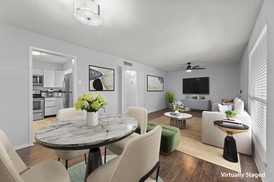 Dining room looking into kitchen & living