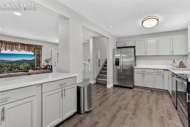 Hand-through window from living room to kitchen