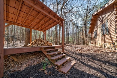 Deck featuring a forest view