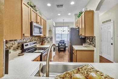 Kitchen featuring an inviting chandelier, light ha