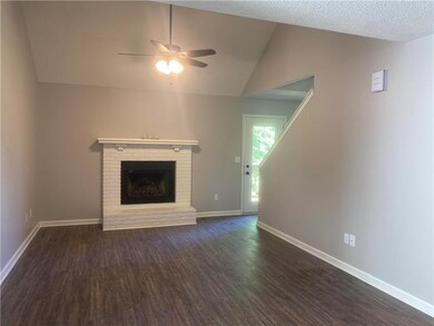 Vaulted living room with fireplace