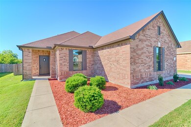 View of front of home featuring brick siding