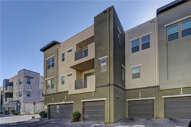 View of property featuring an attached garage and