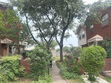 Tucked away in this lush courtyard, you are surrounded by greenery, trees and a private entry.