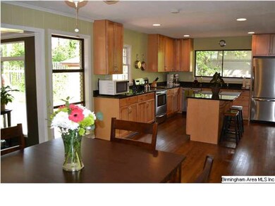 Amazing updated kitchen is open to den, dining, an