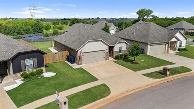 Ranch-style home with concrete driveway, an attached garage, and roof with shingles