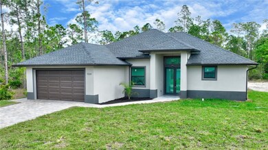 View of front of property featuring a garage, fren