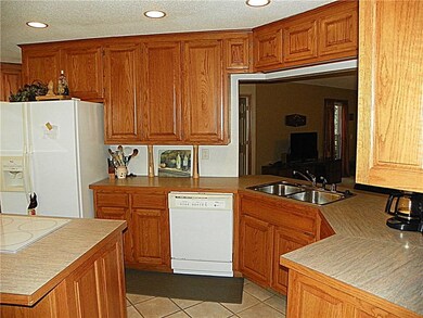 Being part of the party and having fun while you're in the kitchen is easy when you can also keep an eye on your guests in the living room!