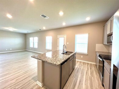 Kitchen with a sink, stainless steel appliances, 