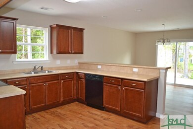 Vinyl plank throughout kitchen and dining room wit