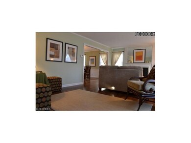 View from front hall into living room and dining r
