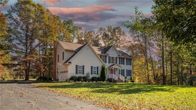 View of front of house with a lawn and a garage