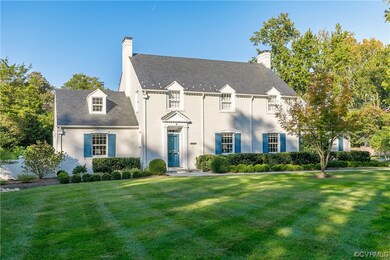 View of front of house with a large lawn.