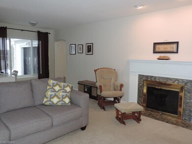 This attractive living room has a gas fireplace an