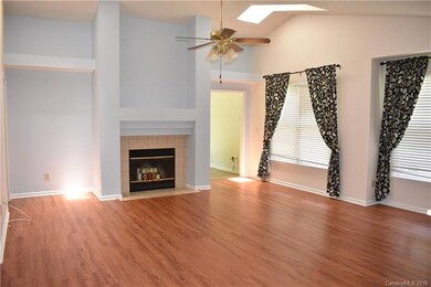 This family room has vaulted ceilings and skylight