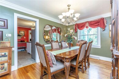 Dining room with chair rails and chandelier