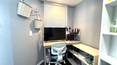 Office area featuring baseboards