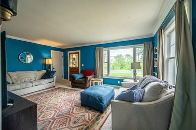 The spacious Living Room has crown molding, large 