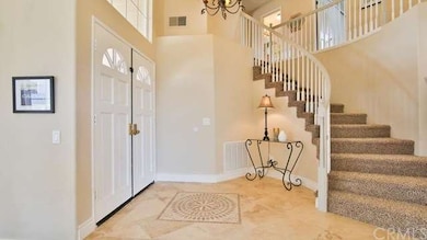 Beautiful custom tile inlay and travertine floorin