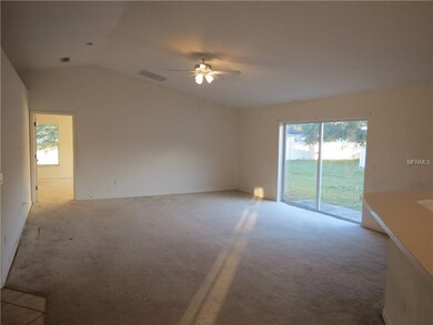 Living room. Needs new flooring...