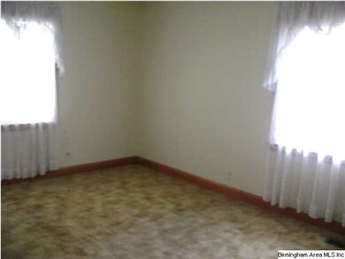 Spacious corner bedroom w/hardwood under carpet th