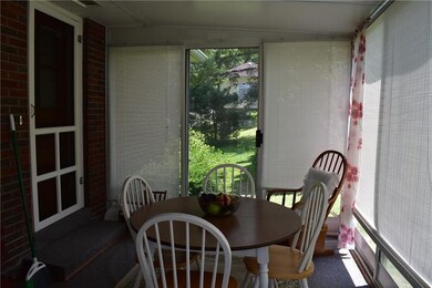 Enclosed Sunroom With Access From The Front & Rear