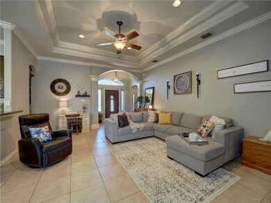 The open concept living area is divided from the k