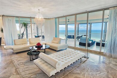 Living area featuring a chandelier, stone finish f