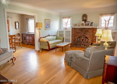 Formal Living Room with Brick Fireplace