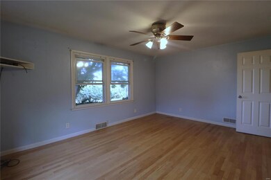 Unfurnished room featuring ceiling fan and light hardwood / wood-style floors