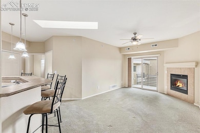 Living room featuring baseboards, visible vents, c