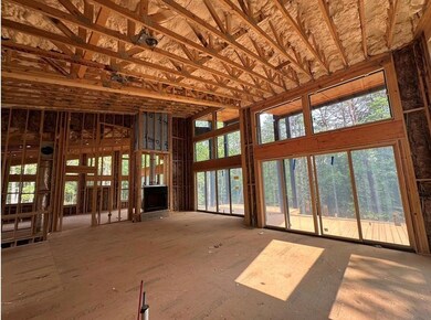 Unfurnished living room with a high ceiling
